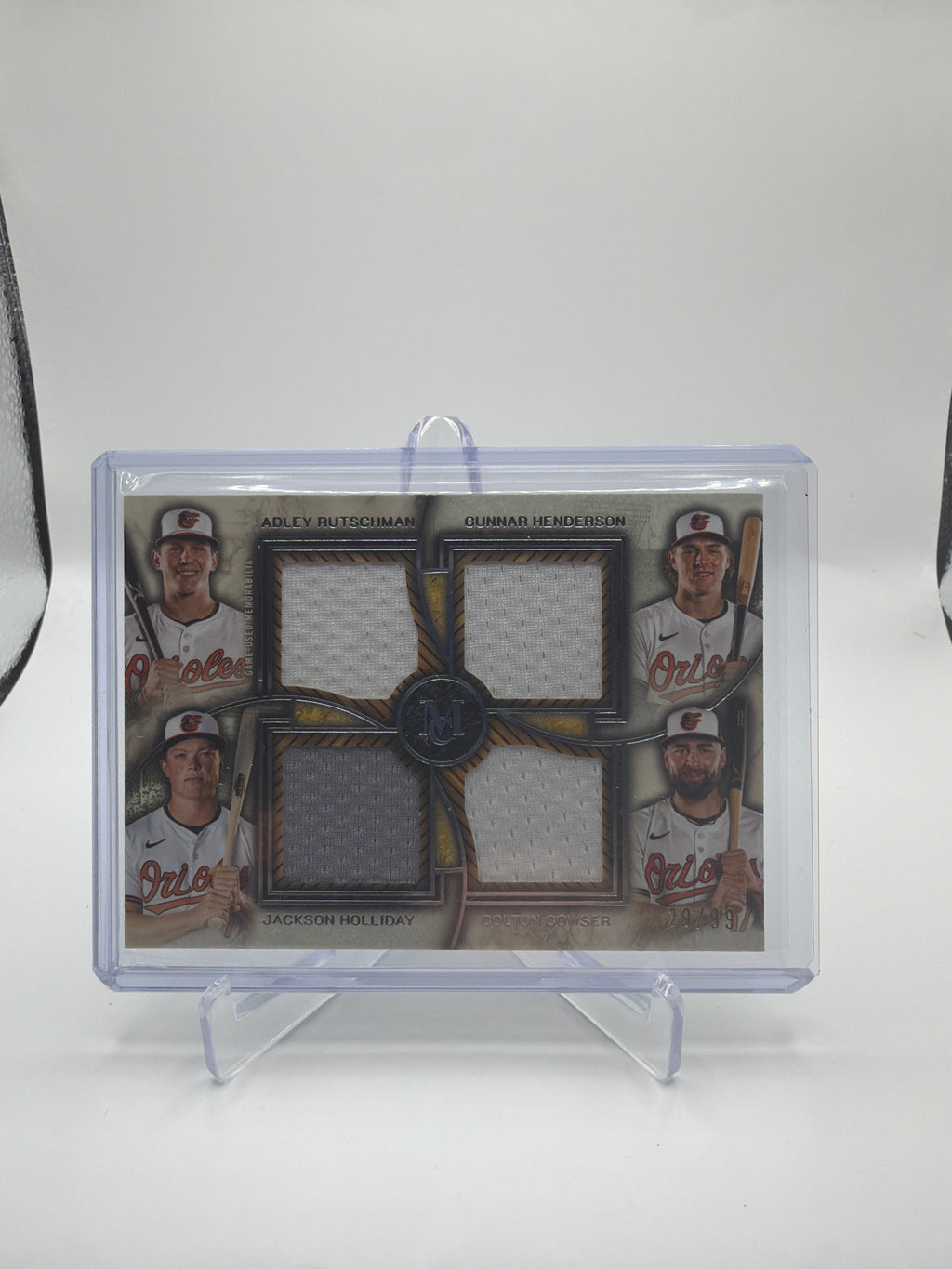 2025 Topps Museum Collection Primary Pieces Quad Relic Baltimore Orioles Adley Rutschman / Gunnar Henderson / Jackson Holliday / Colton Cowser #FPQR-RHHC /99