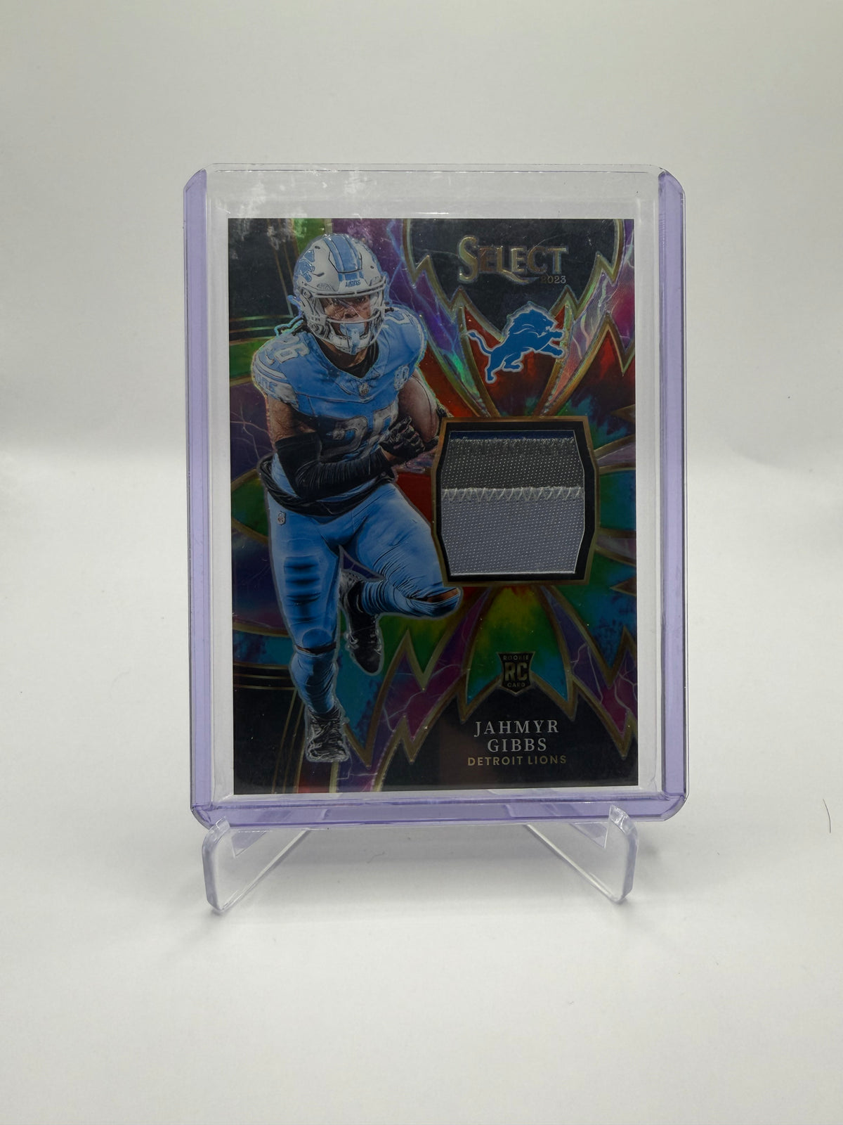 2023 Panini Select Football Jahmyr Gibbs Sparks Tie-Dye Prizm Rookie Memorabilia #SP-JGI /25